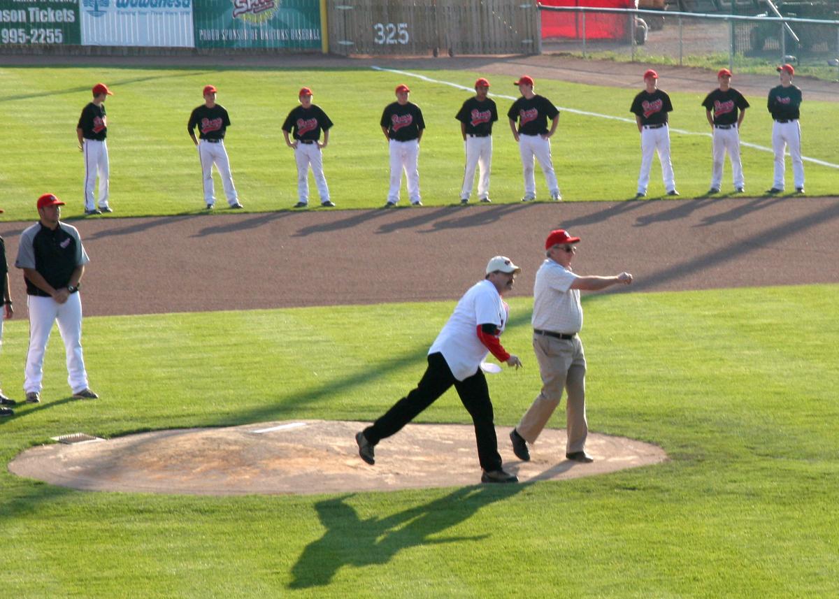 Mayor Robertson throwing the first pitch at an Okotoks Dawgs game in 2011