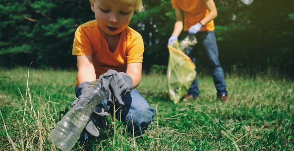 family-volunteers-with-children-collecting-garbage-park-save-environment-concept-little-boy-his-father-cleaning-up-forest