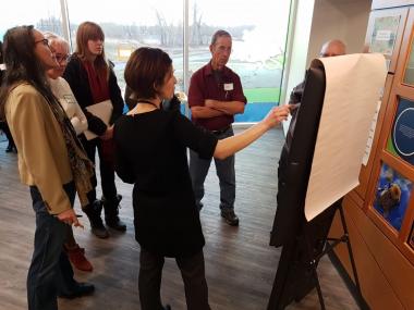 A group of stakeholders participating in community engagement during the Okotoks Environmental Master Plan development