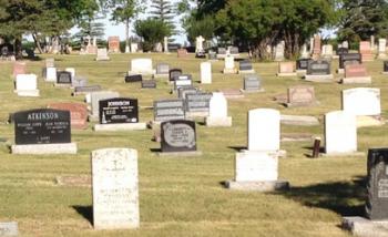 Photograph of headstones in the Okotoks Cemetery.