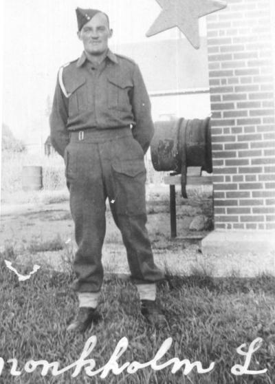 Black and white photo of a man in World War Two army uniform.