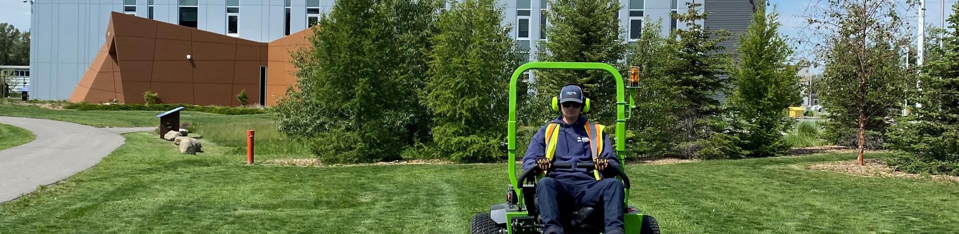 Electric Lawn Mower cutting grass