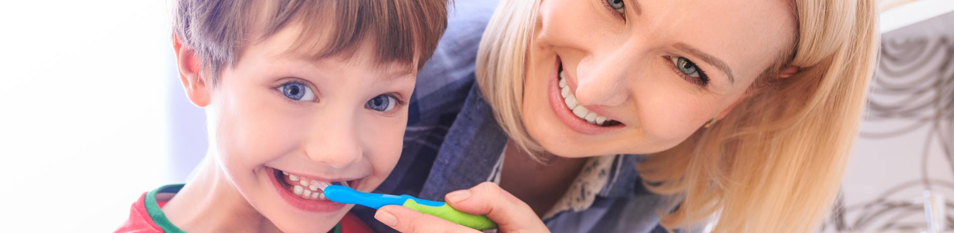 appy-family-mother-child-little-boy-cleans-teeth-with-toothbrush-bathroom