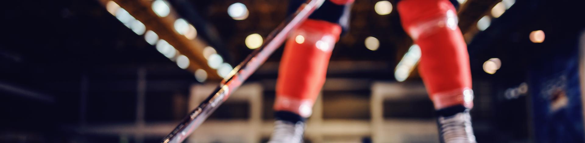 close-up-hockey-player-skating-with-stick-puck