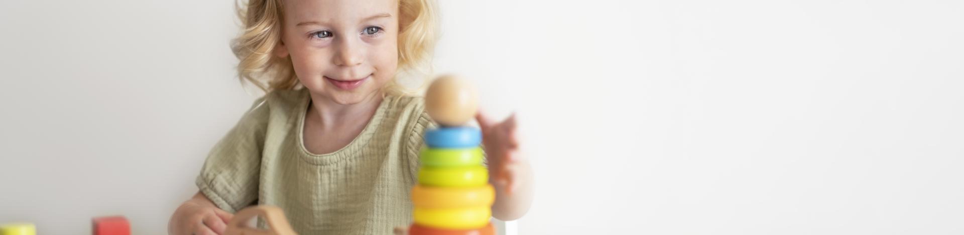caucasian-toddler-child-baby-girl-2-year-playing-with-colourful-wooden-eco-pyramid