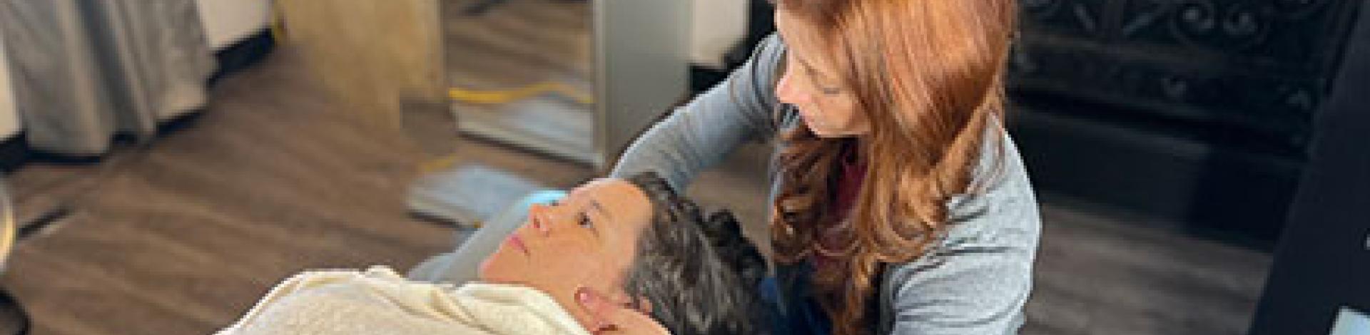 Female chiropractor performing an adjustment on a patient