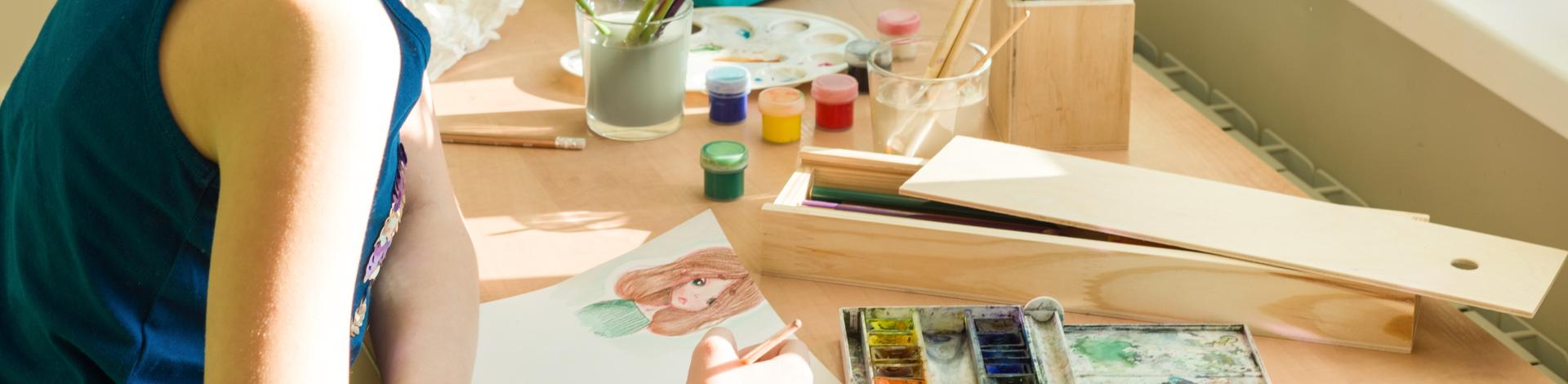 a teen working on art
