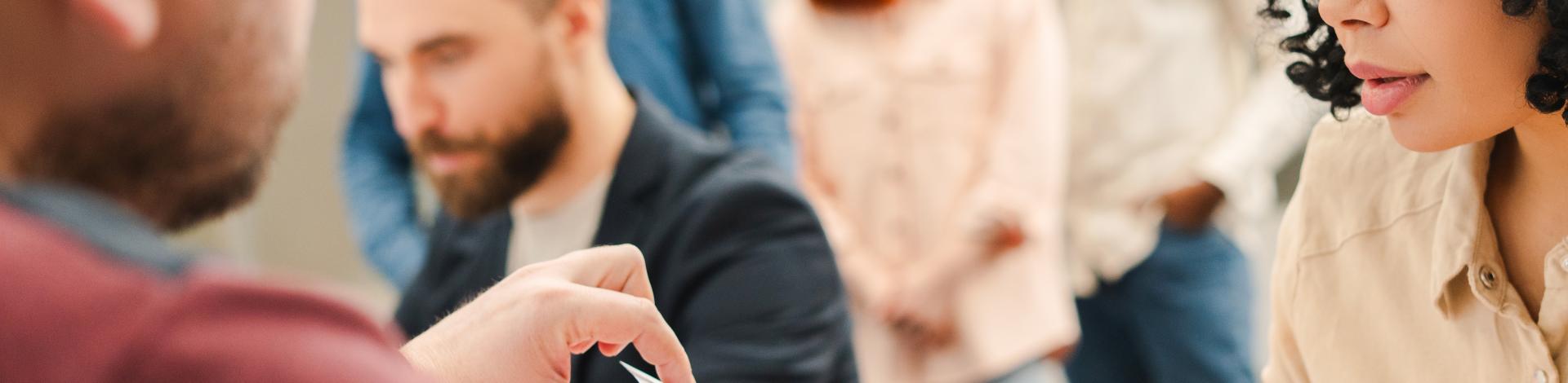 multiracial-group-people-african-american-woman-sitting-registration-table-filling-out-ballot