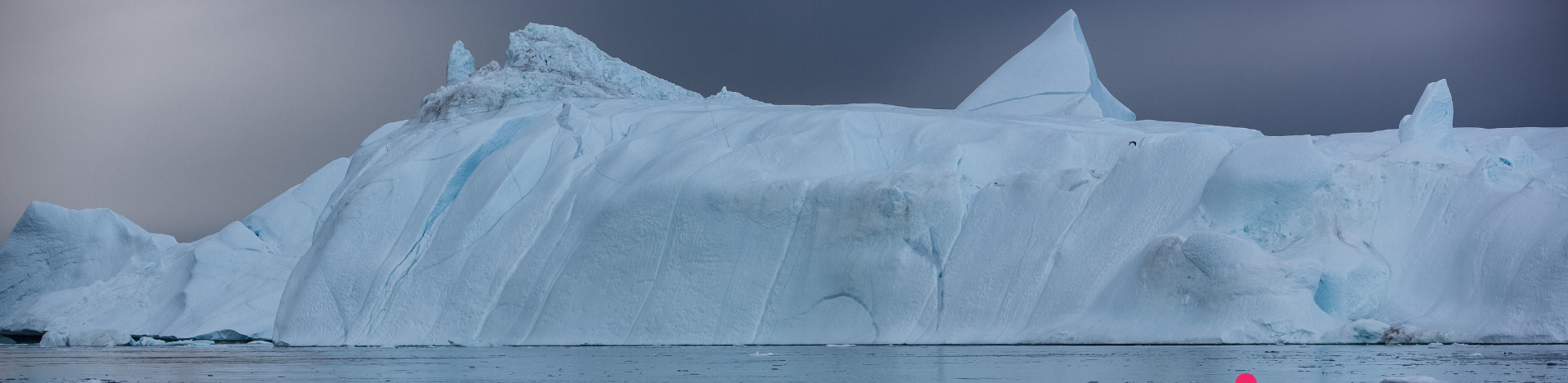 Scenic view of frozen lake against sky