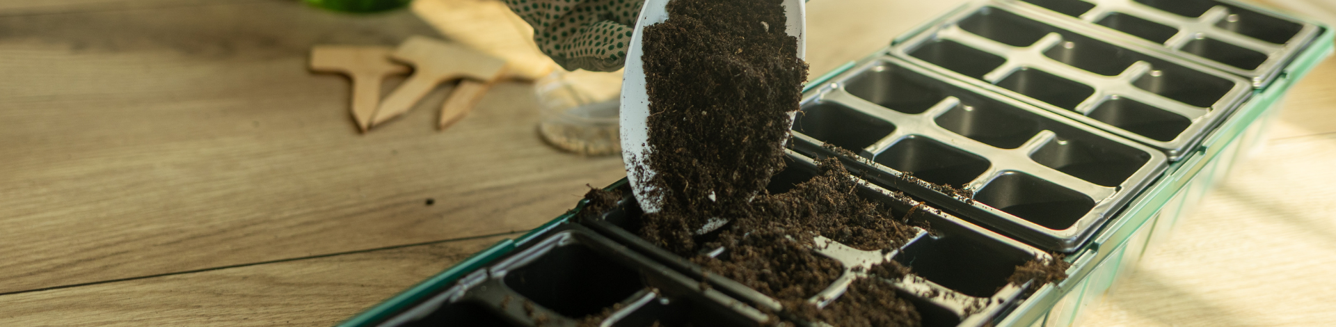 Soil being poured into a large container