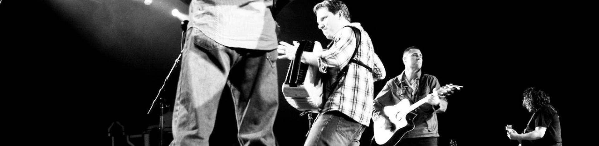 a celtic band on stage in blacka and white