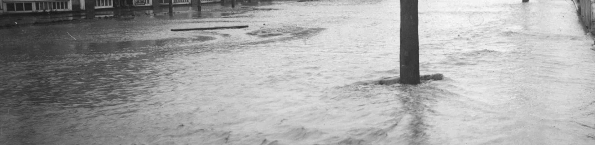 an old photo of a flood in okotoks