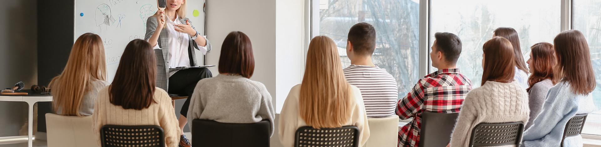 teaching young people in office