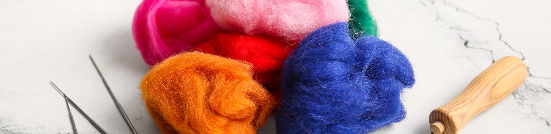 Colorful wool roving with felting needles