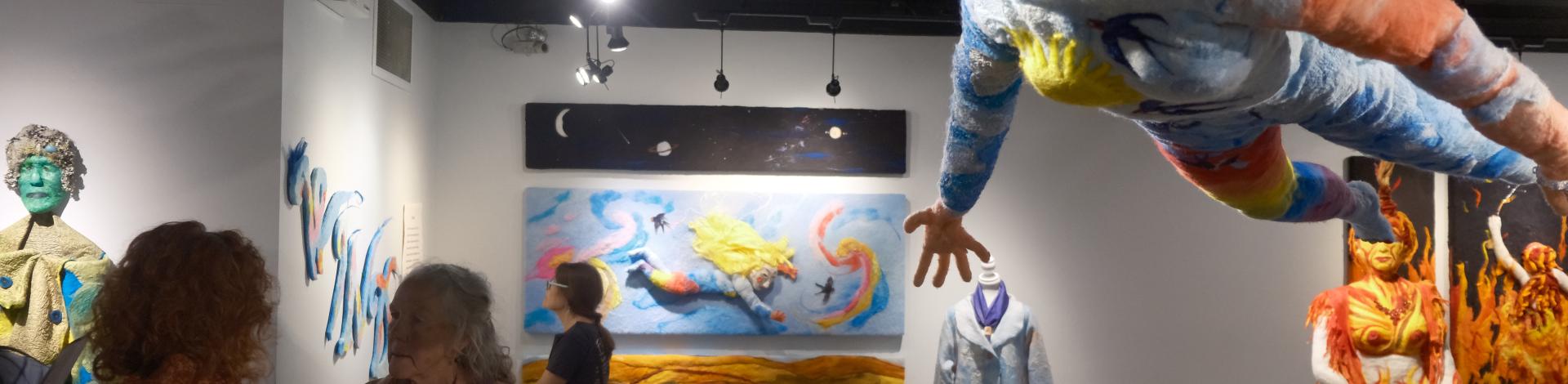 an art gallery with lifesized artwork