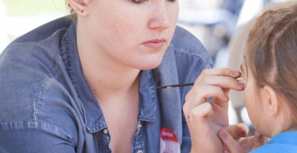 Young face painter