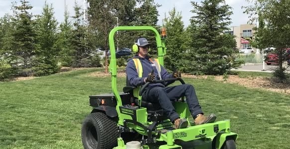 Electric Lawn Mower cutting grass
