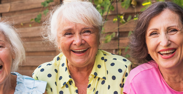 Senior women laughing in a garden