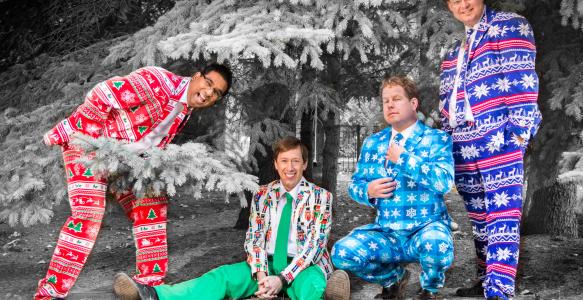 members of the Heebee-jeebees stand in bold Christmas suits