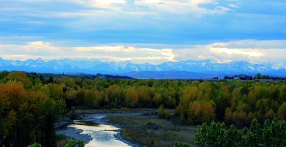 Okotoks Sheep River with Mountains in background