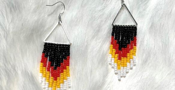 Black, red, yellow, and white beaded earrings.