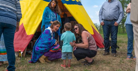 Mayor Thorn with Okotoks Residents in front of Town Tipi 