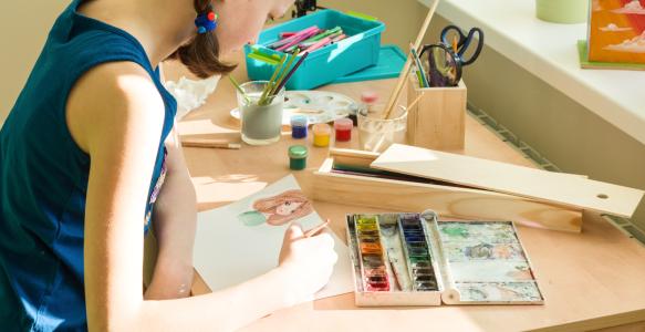 a teen working on art