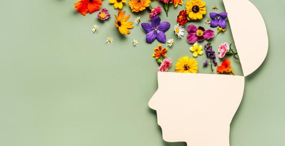 a drawn head with flowers