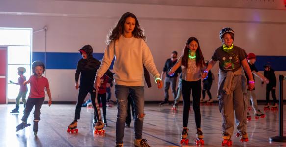 youth roller skating in the gymnasium