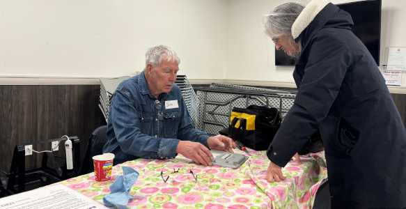 A man and woman prepare to repair an item at a Repair Cafe
