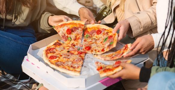 close-up-take-away-pizza-teenagers-hands