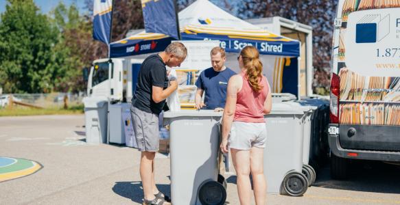 residents dropping off documents for secure shredding. photo credit: Record Express