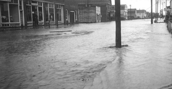 an old photo of a flood in okotoks