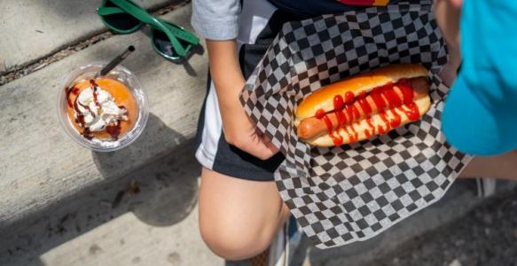 a hotdog covered in ketchup