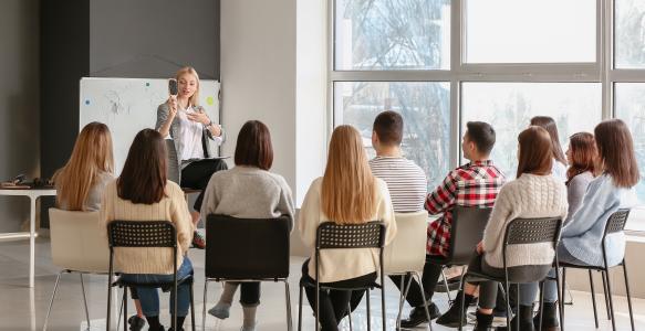teaching young people in office