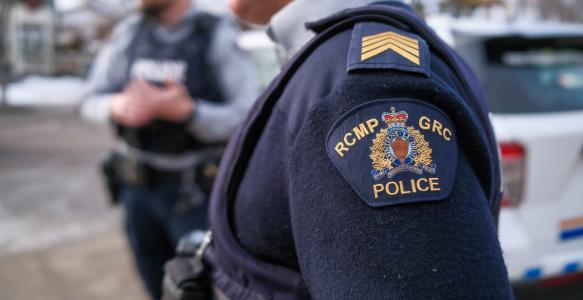 RCMP crest on sleeve of police person