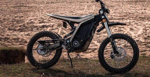 Sur-ron style e-dirt bike with electric motor on sand