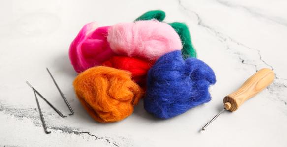 Colorful wool roving with felting needles