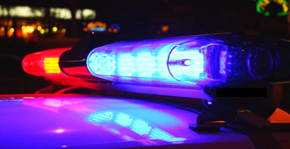 Lit up Police lights at night