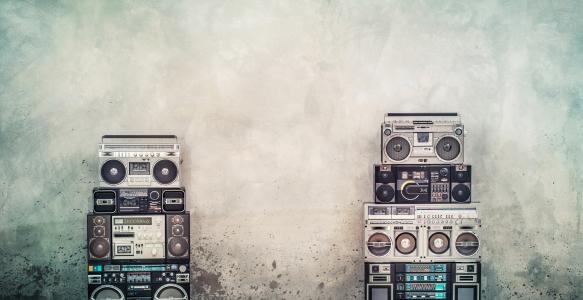Retro old design boombox on a concrete street wall