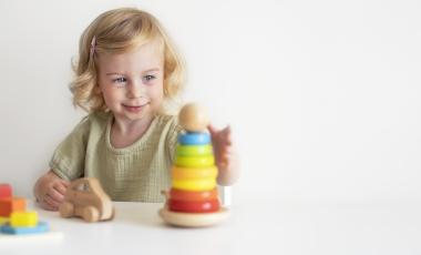 caucasian-toddler-child-baby-girl-2-year-playing-with-colourful-wooden-eco-pyramid