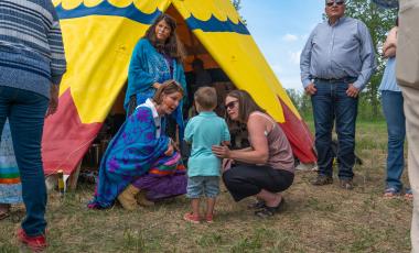 Mayor Thorn with Okotoks Residents in front of Town Tipi 