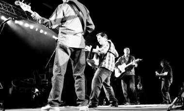 a celtic band on stage in blacka and white
