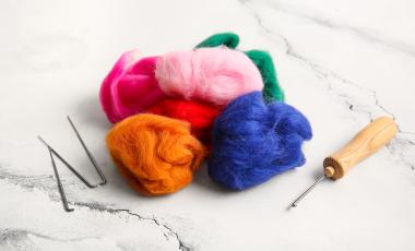 Colorful wool roving with felting needles