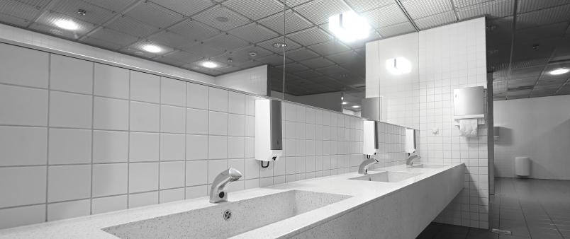 public restroom washroom with automated low flow water faucets