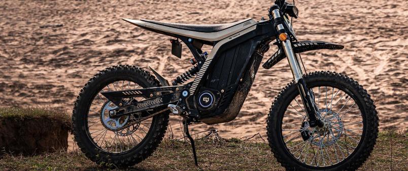 Sur-ron style e-dirt bike with electric motor on sand