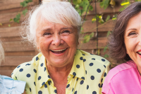 Senior women laughing in a garden