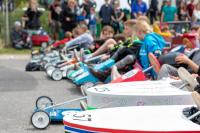 kids in soapbox carts line up for a photo