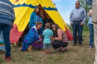 Mayor Thorn with Okotoks Residents in front of Town Tipi 