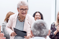 older adult engaging with older adult audience